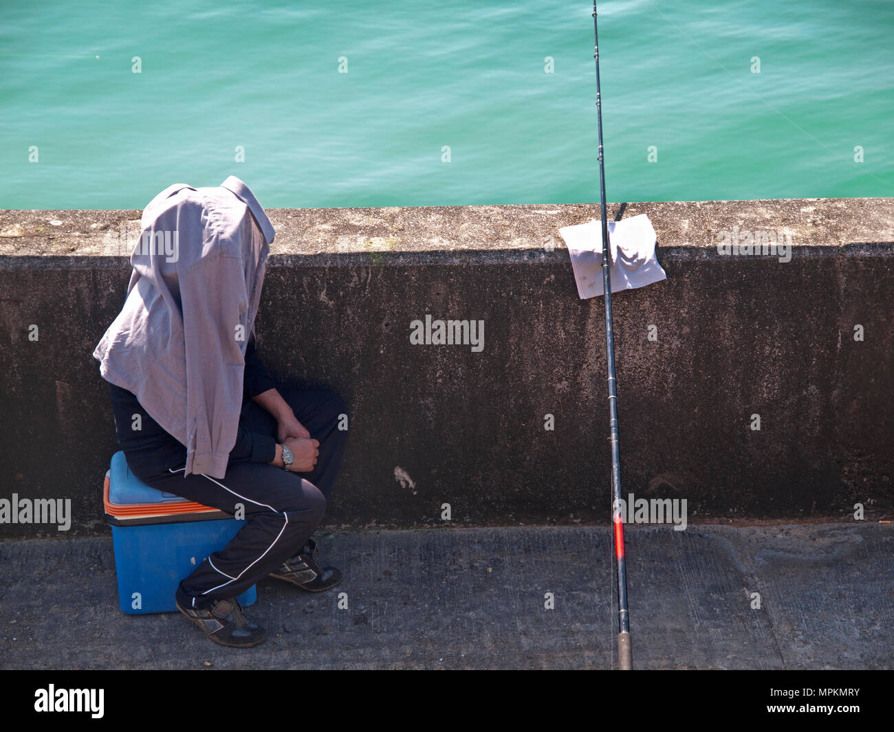 Fishing off Brighton Marina Stock Photo Alamy