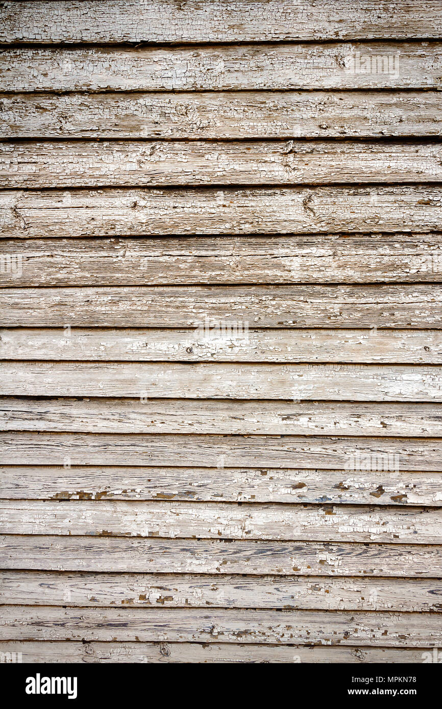 Peeling white paint on weathered wood planks texture Stock Photo