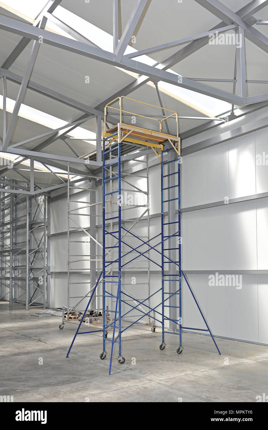 Mobile Scaffolding Tower Platform in Distribution Warehouse Stock Photo
