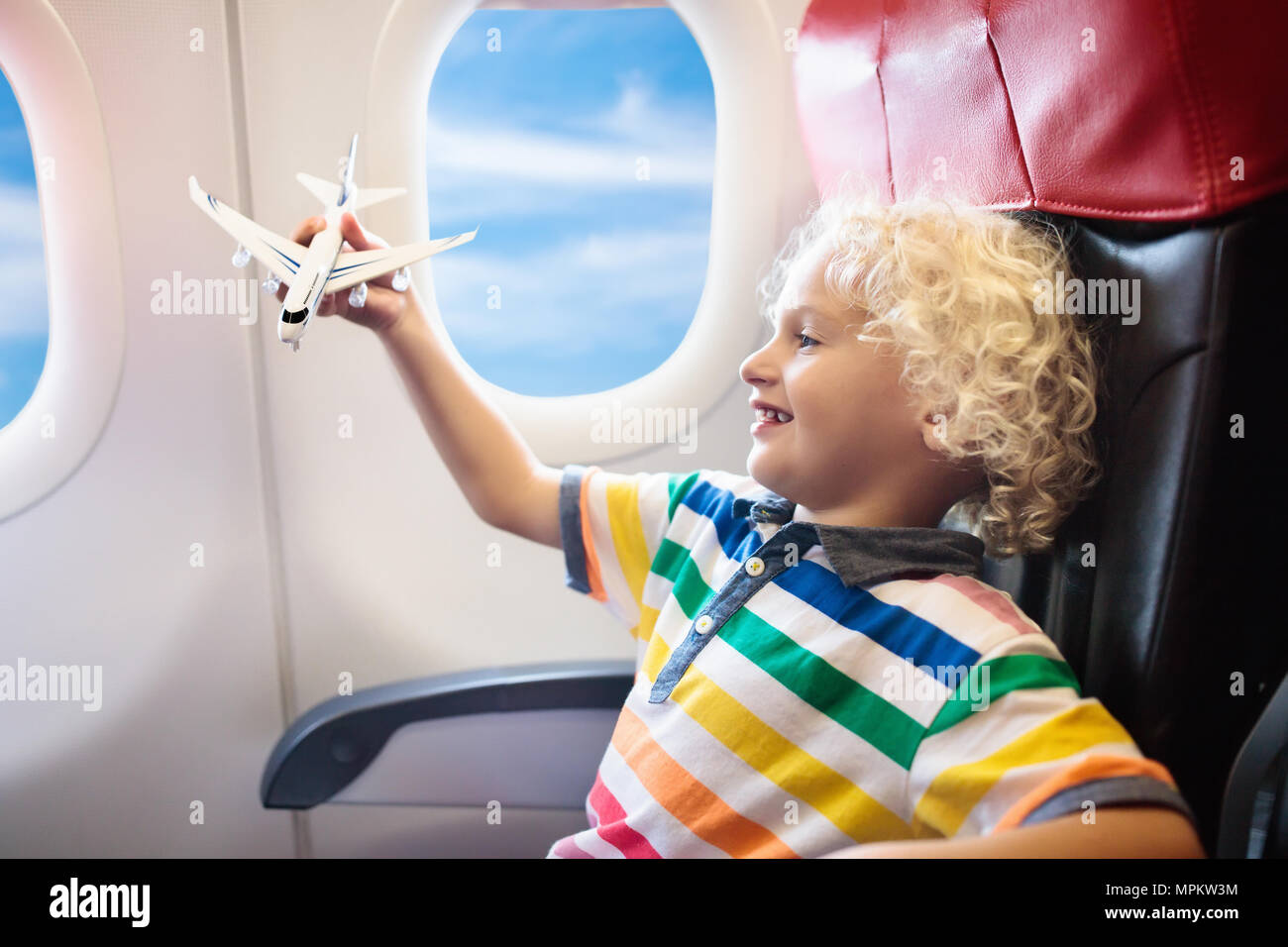 Child In Airplane Kid In Air Plane Sitting In Window Seat Flight Entertainment For Kids Traveling With Young Children Kids Fly And Travel Family Stock Photo Alamy Child In Airplane Kid In Air Plane Sitting In Window Seat Flight Entertainment For Kids Traveling With Young Children Kids Fly And Travel Family Stock Photo Alamy
