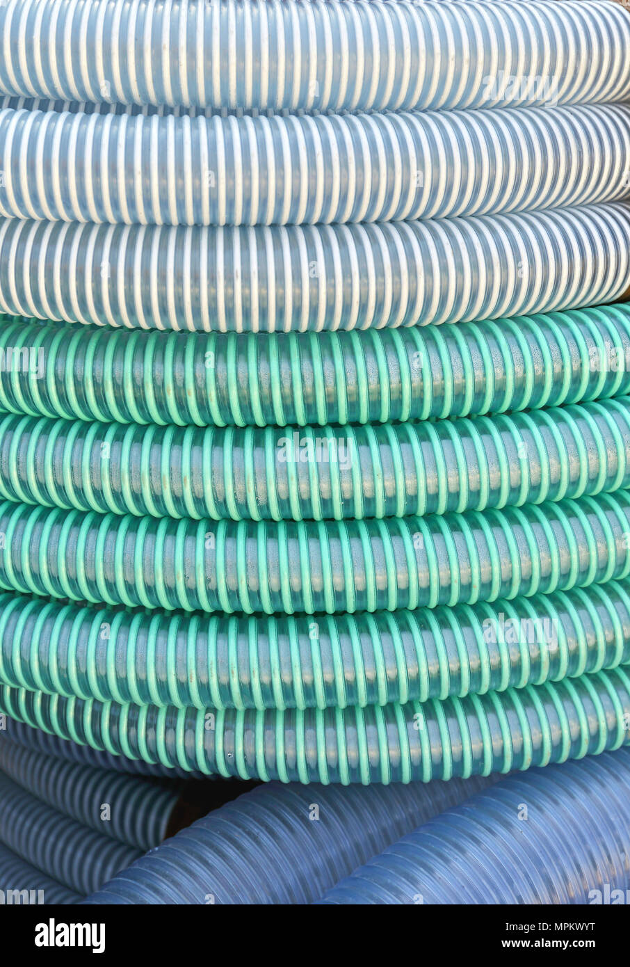 Flexible Plastic Pipes and Hoses in Coils Stock Photo