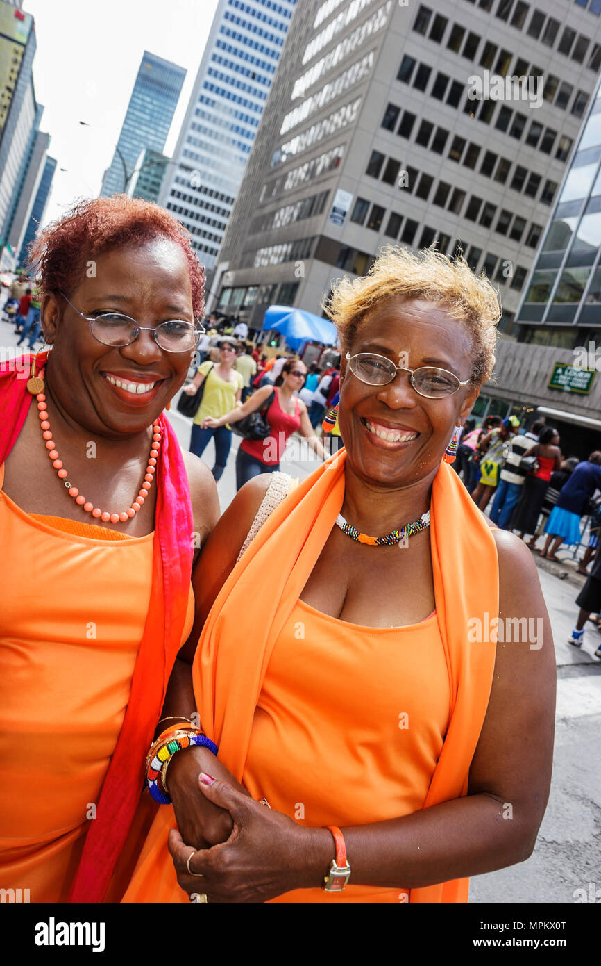 Montreal Canada,Quebec Province,Boulevard Rene Levesque,Carifiesta,Mardi Gras style Caribbean parade,smiling Black women Canada070707113 Stock Photo