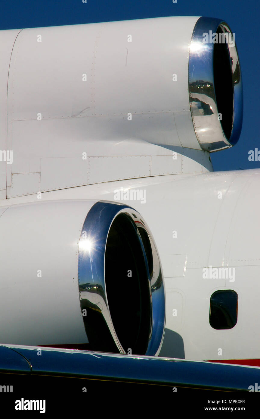 Anonymous business jet, biz jet, executive jet. Jet engine intakes. White jet. Blue sky Stock Photo