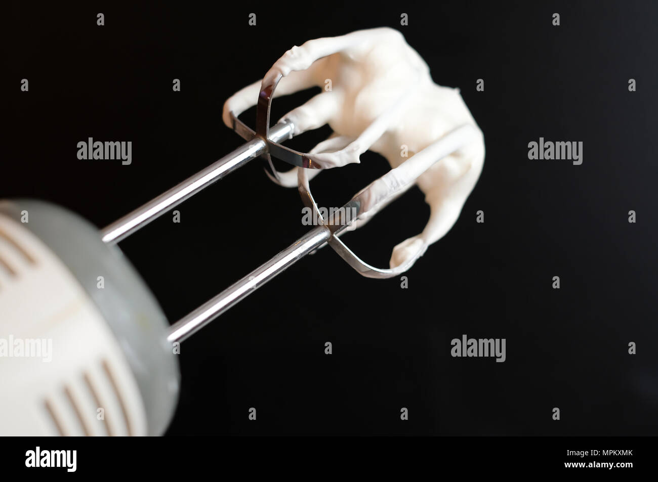 https://c8.alamy.com/comp/MPKXMK/electric-hand-mixer-with-whipped-cream-on-the-whisk-or-beater-on-a-black-background-selective-focus-dessert-cooking-or-baking-at-home-MPKXMK.jpg