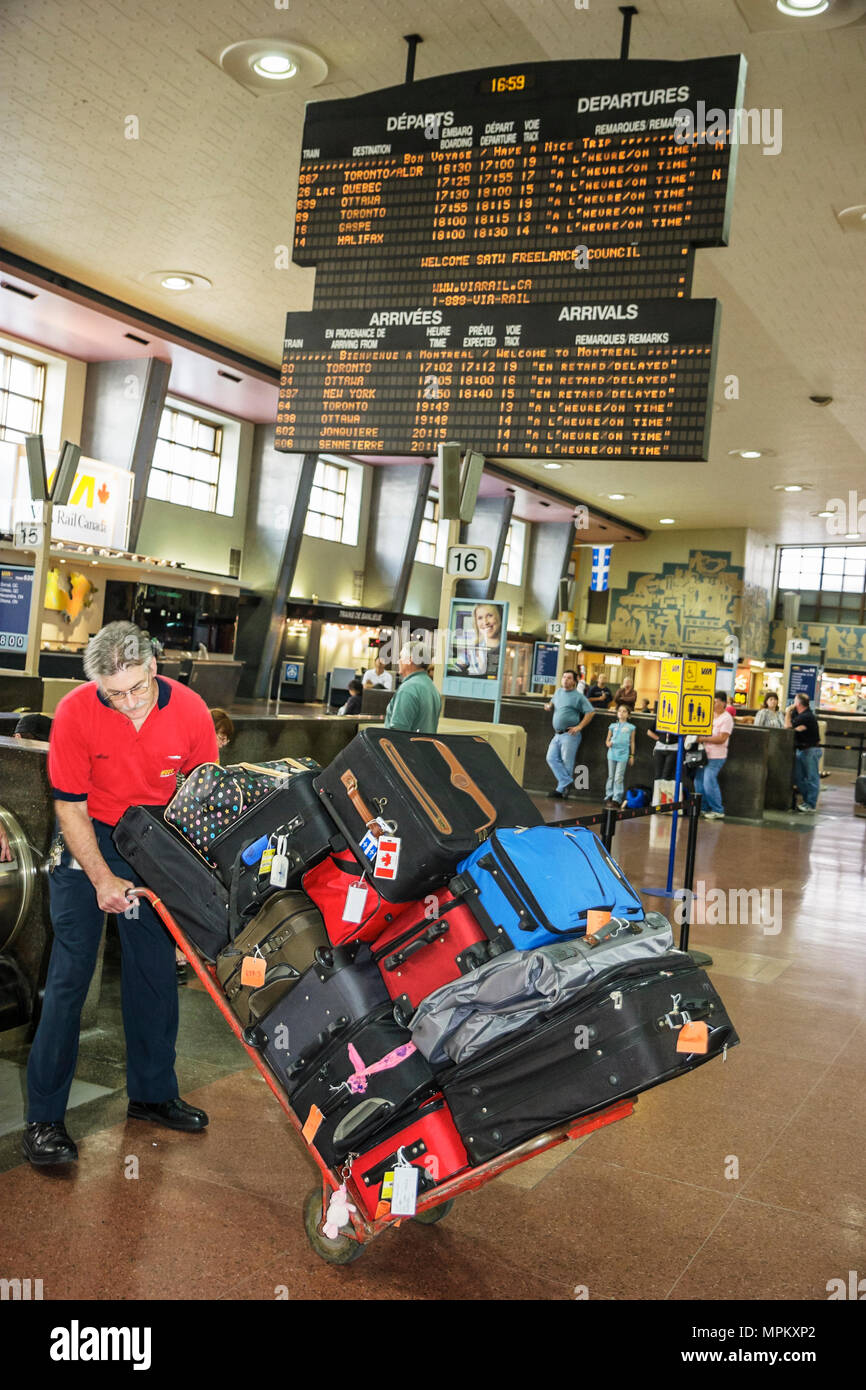 Montreal Canada,Quebec Province,Gare Centrale,Central Train Station,schedule,ticketing,porter,luggage,suitcase cart,Canada070708100 Stock Photo