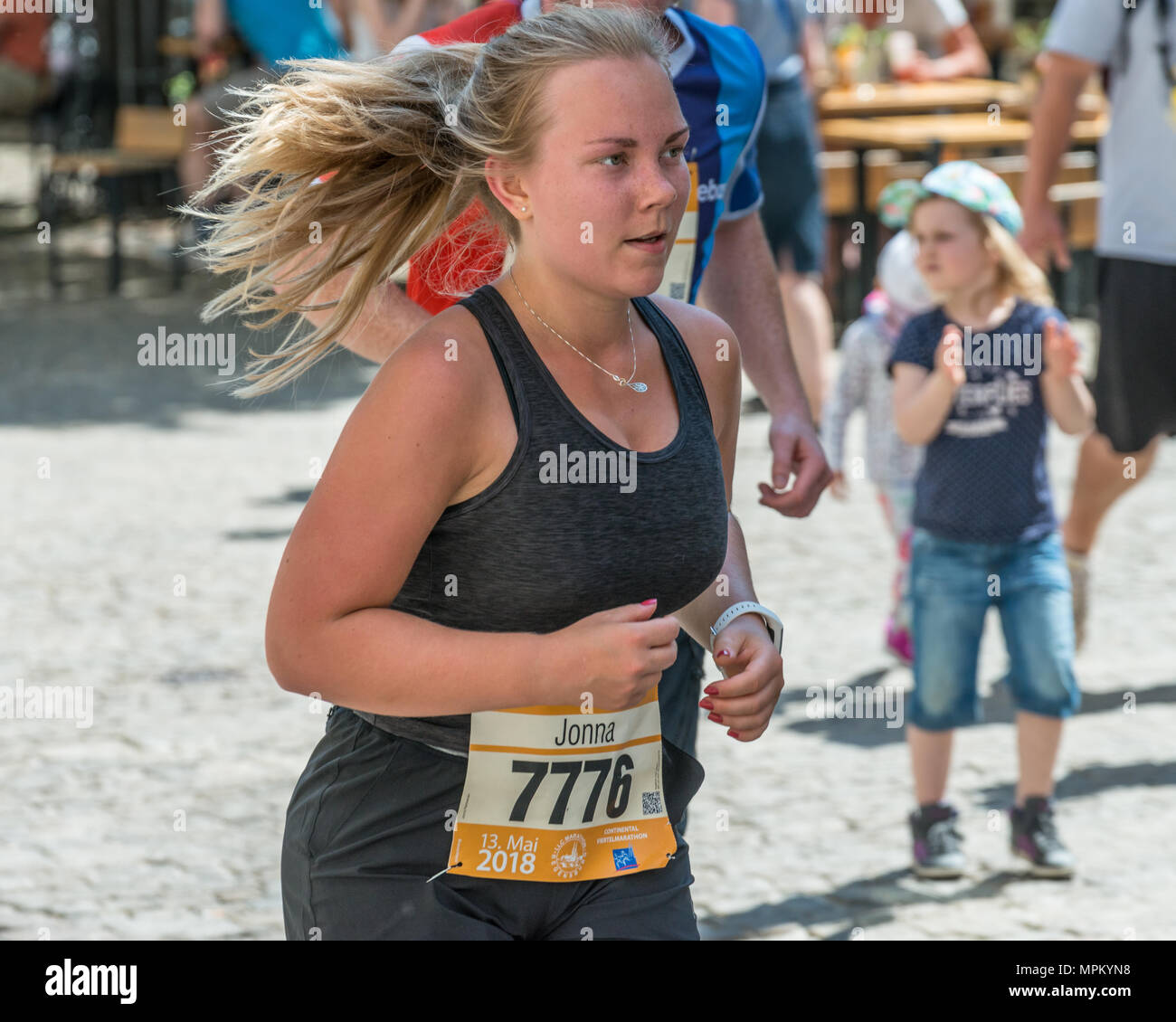 Regensburg, Bavaria, Germany, May 13, 2018: Participant of the Regensburg Marathon 2018 at the old city hall Stock Photo