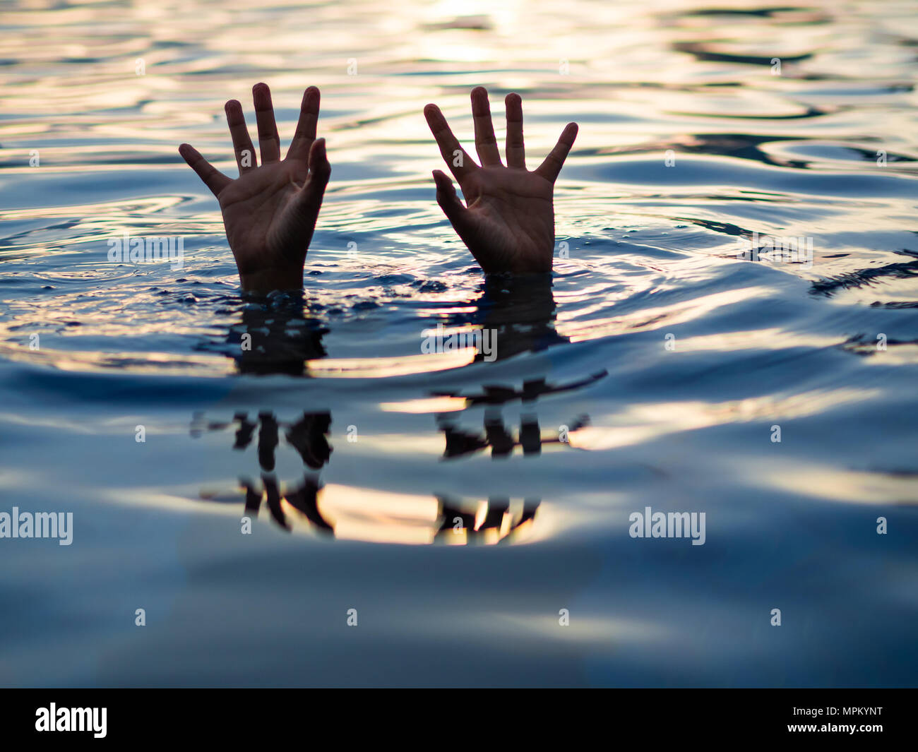 Drowning victims, Hand of drowning man needing help. Failure and rescue concept. Stock Photo