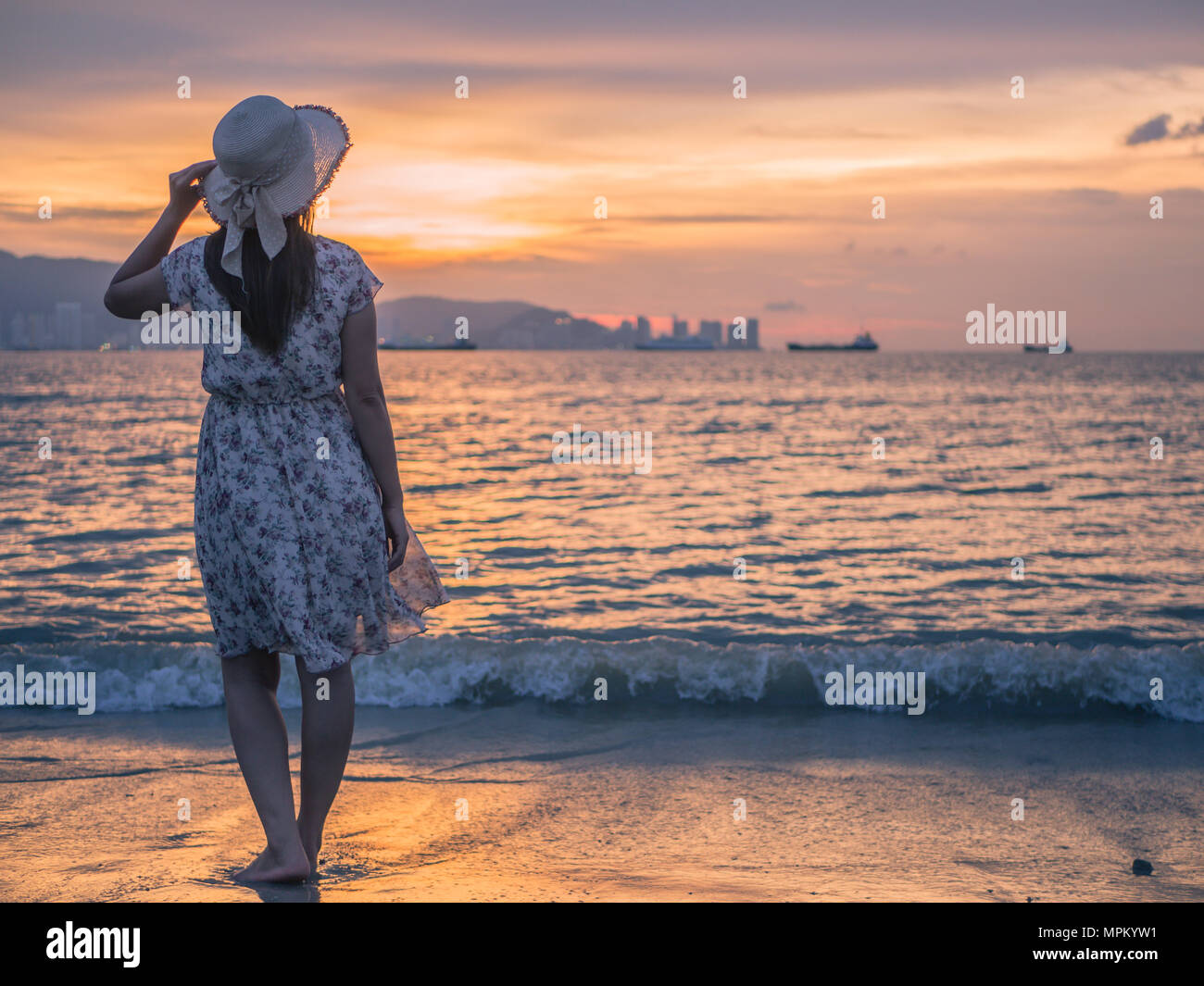 depressed woman holding a hat 
