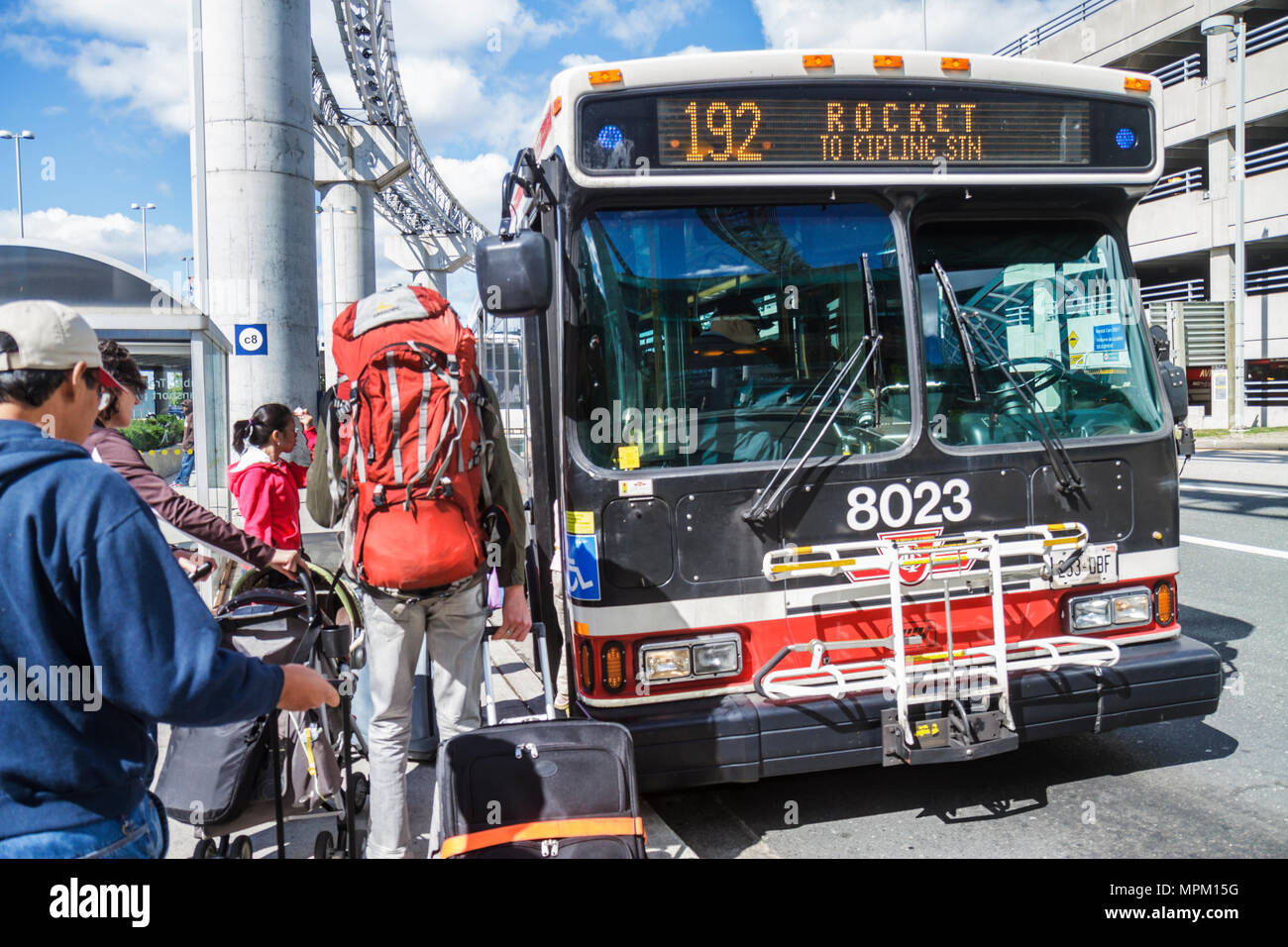 Toronto Canada,Lester B. Pearson International Airport,YYZ,TTC,public bus,coach,transportation,mass transit,stop,Asian woman female women,man men male Stock Photo