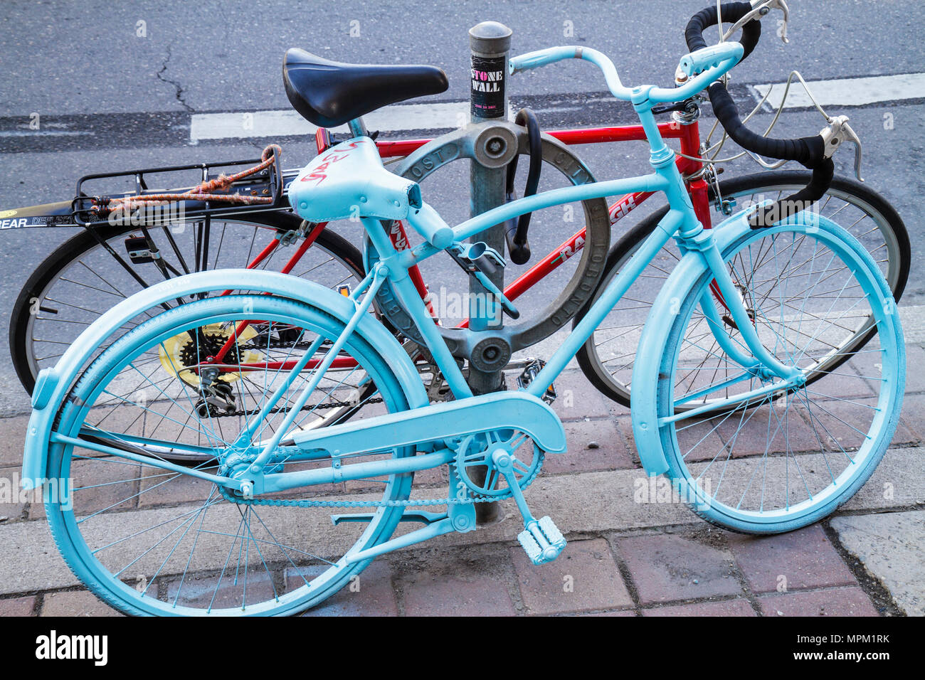 Toronto Canada,Spadina Avenue,Chinatown neighborhood,abandoned bicycle,bicycling,riding,biking,rider,repainted,The Good Bike Project,pastel blue,civic Stock Photo