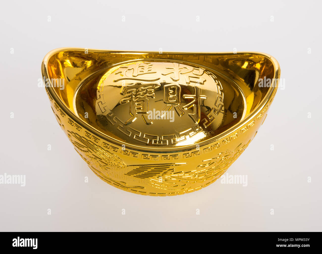 Gold or Chinese gold ingot mean symbols of wealth and prosperity on a  background Stock Photo - Alamy