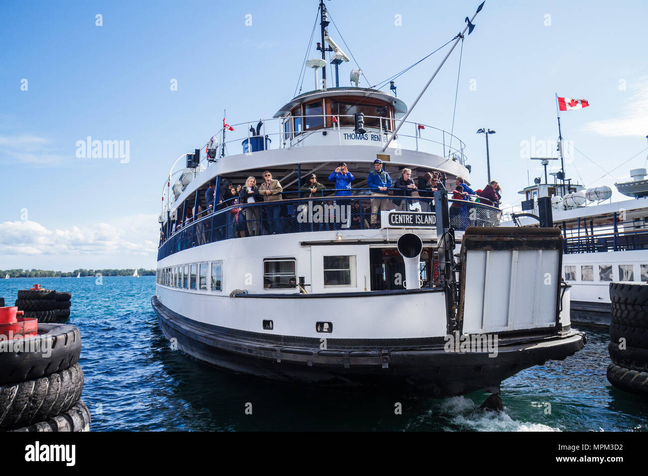 Toronto Canada,Queen's Quay West,Toronto Island Islands ferries,ferry,boat,Centre Island,Thomas Rennie,Lake Ontario,ticket kiosk,passenger passengers Stock Photo