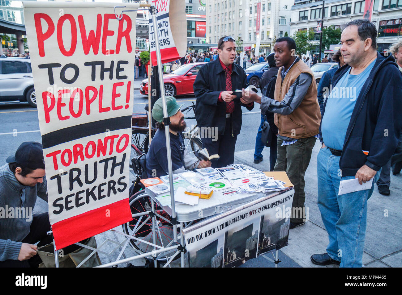 Toronto Canada,Yonge Street,Dundas Square,booth,stand,brochure brochures folder folders pamphlet pamphlets information,activist,social,political,activ Stock Photo