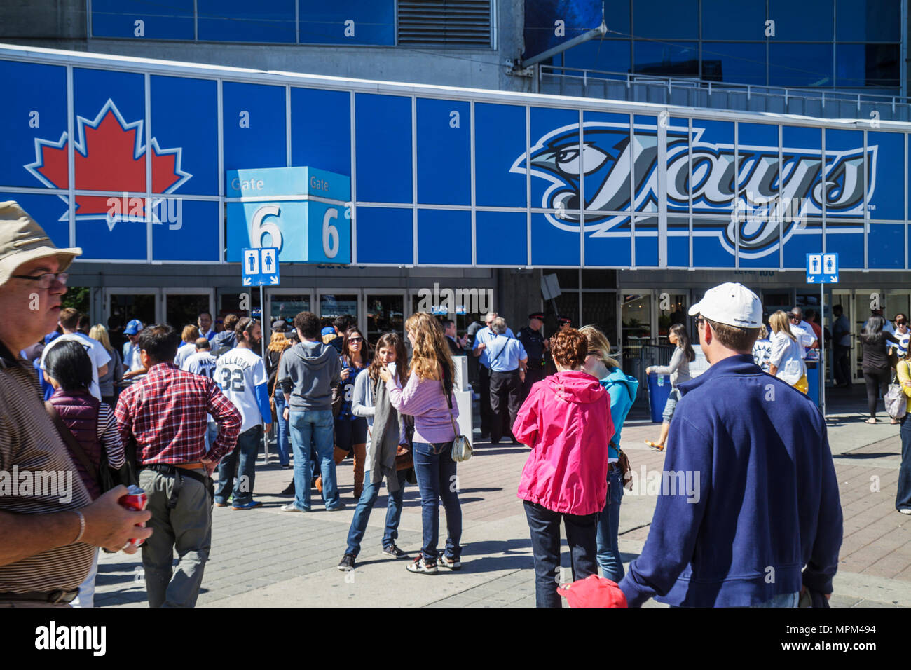 Toronto Canada,Bremner Boulevard,Rogers Centre,center,Blue Jays Major League Baseball teamal sports,outside stadium,game day,crowd,arriving fans,adult Stock Photo
