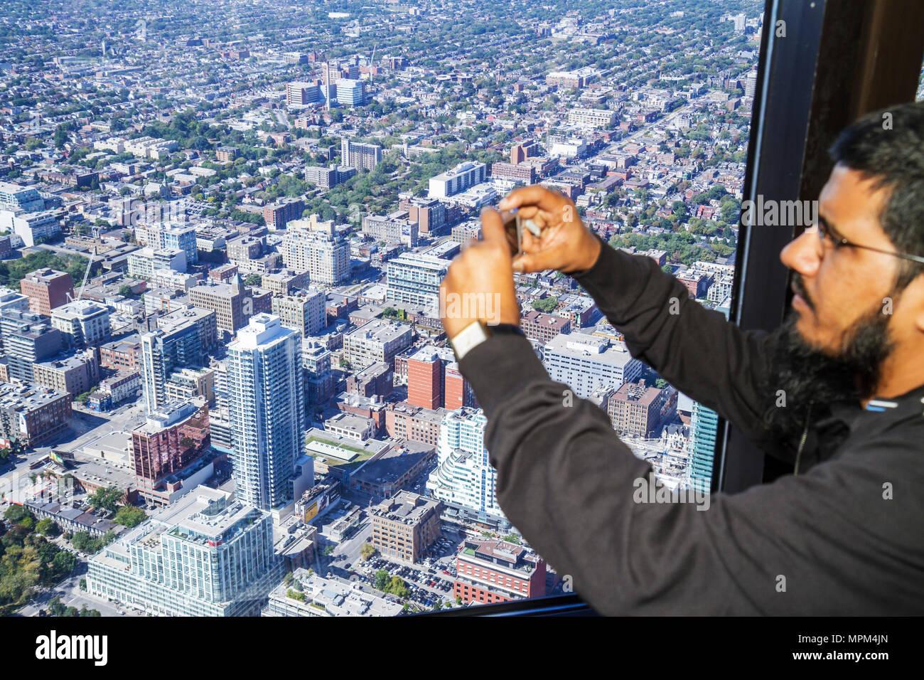 Toronto Canada,Bremner Boulevard,CN Tower,observation tower,telecomm antenna modern wonder,main deck level,window view northeast,high rise skyscraper Stock Photo