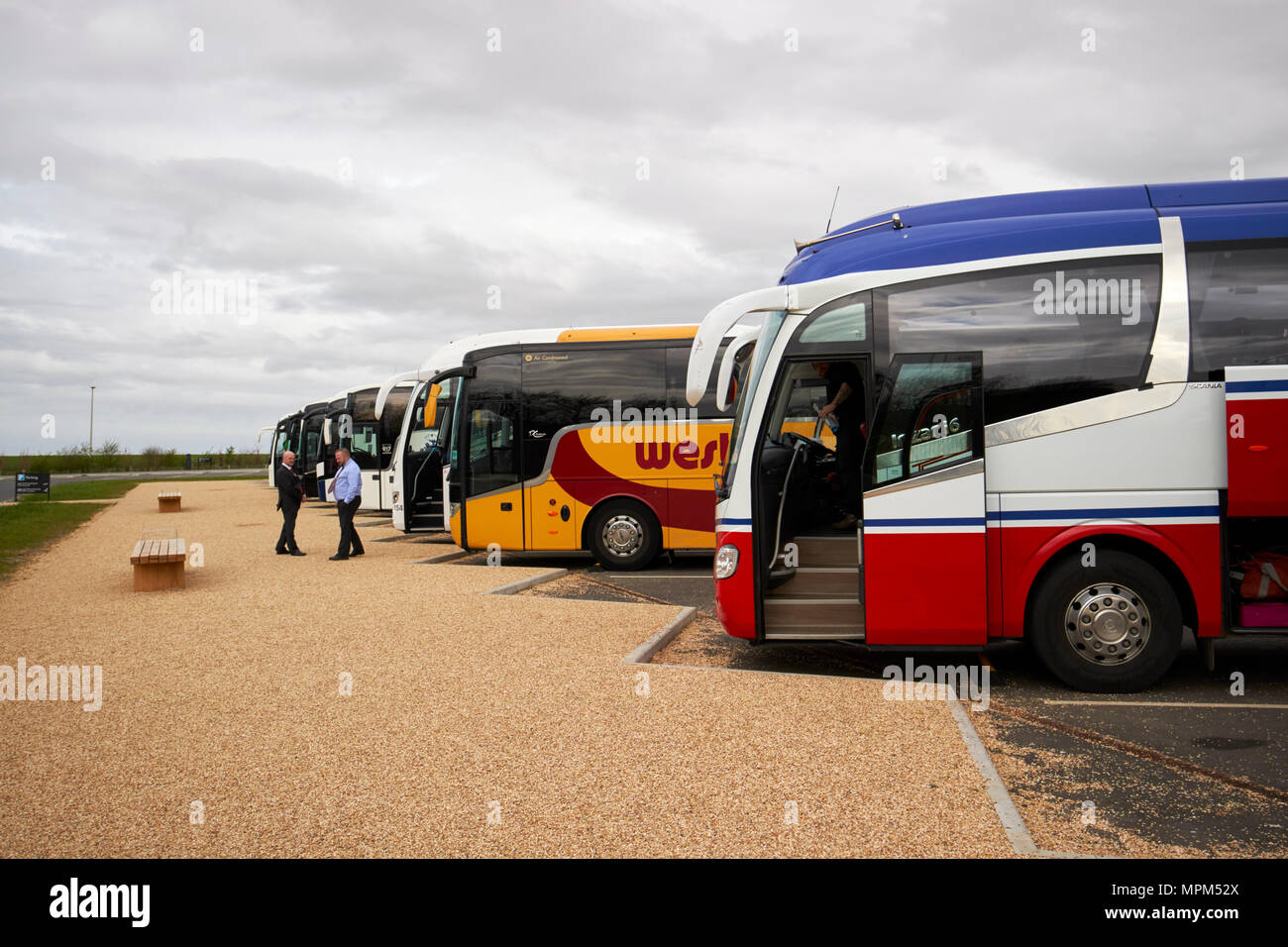 queue of tour busses in the car park in stonehenge wiltshire england uk Stock Photo