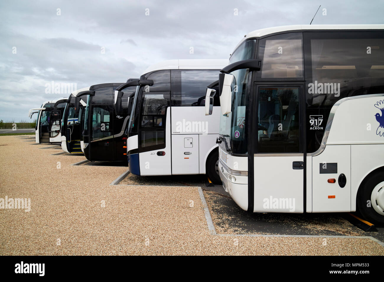 queue of tour busses in the car park in stonehenge wiltshire england uk Stock Photo