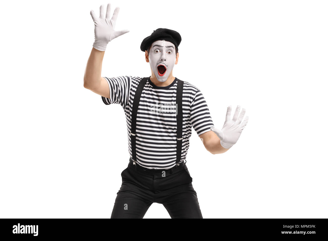Mime holding his hands against an invisible wall isolated on white background Stock Photo