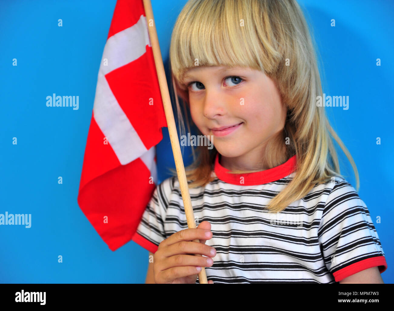 Happy blonde kid with a national flag of Denmark Stock Photo