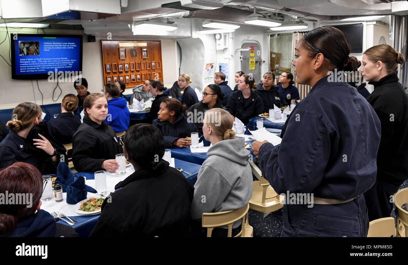 170321-N-RM689-050  U.S. 7TH FLEET AREA OF OPERATIONS (March 21, 2017) Command Master Chief Veronica Holliday, from Reseda, California, speaks with female Sailors aboard Arleigh Burke-class guided-missile destroyer USS Wayne E. Meyer (DDG 108) during a dinner celebrating the 100th anniversary of the first woman to enlist in the military. Wayne E. Meyer is on a regularly scheduled Western Pacific deployment with the Carl Vinson Carrier Strike Group as part of the U.S. Pacific Fleet-led initiative to extend U.S. 3rd Fleet command and control functions into the Indo-Asia-Pacific region. U.S. Navy Stock Photo