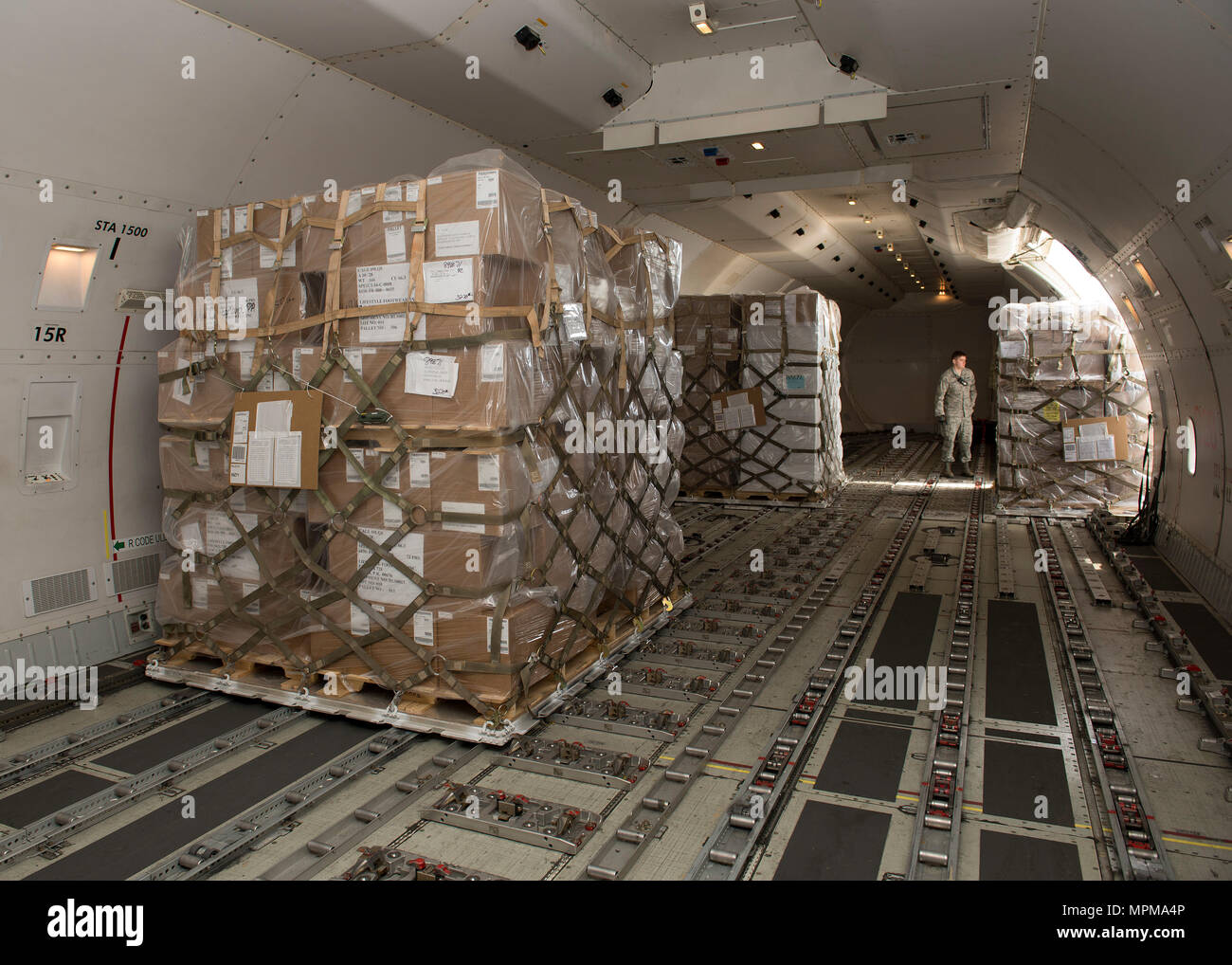 Cargo pallets are loaded into a Kalitta Air Boeing 747 cargo plane by 436th  Aerial Port Squadron Airmen March 24, 2017, at Dover Air Force Base, Del.  Unlike military airlifters that load
