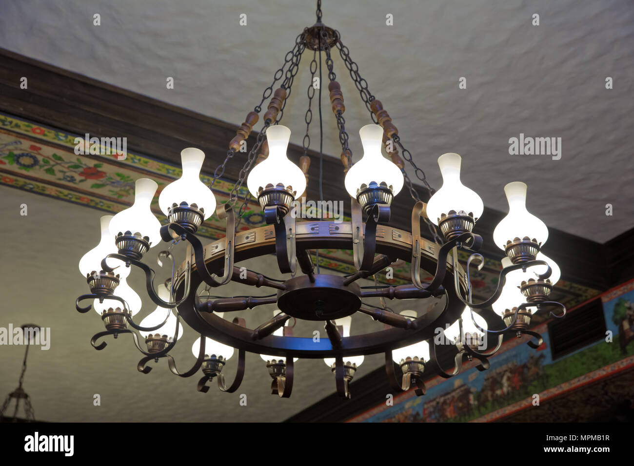 Luxury expensive lamp chandelier hanging under ceiling in palace Stock