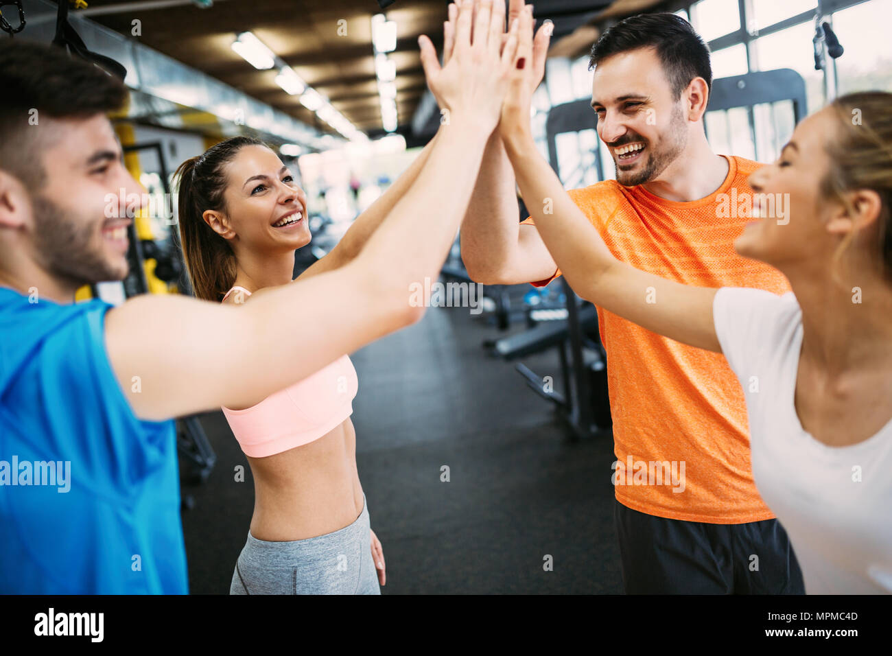 fitness, sport, training, gym, success and lifestyle concept - group of  happy people in the gym celebrating success Stock Photo - Alamy