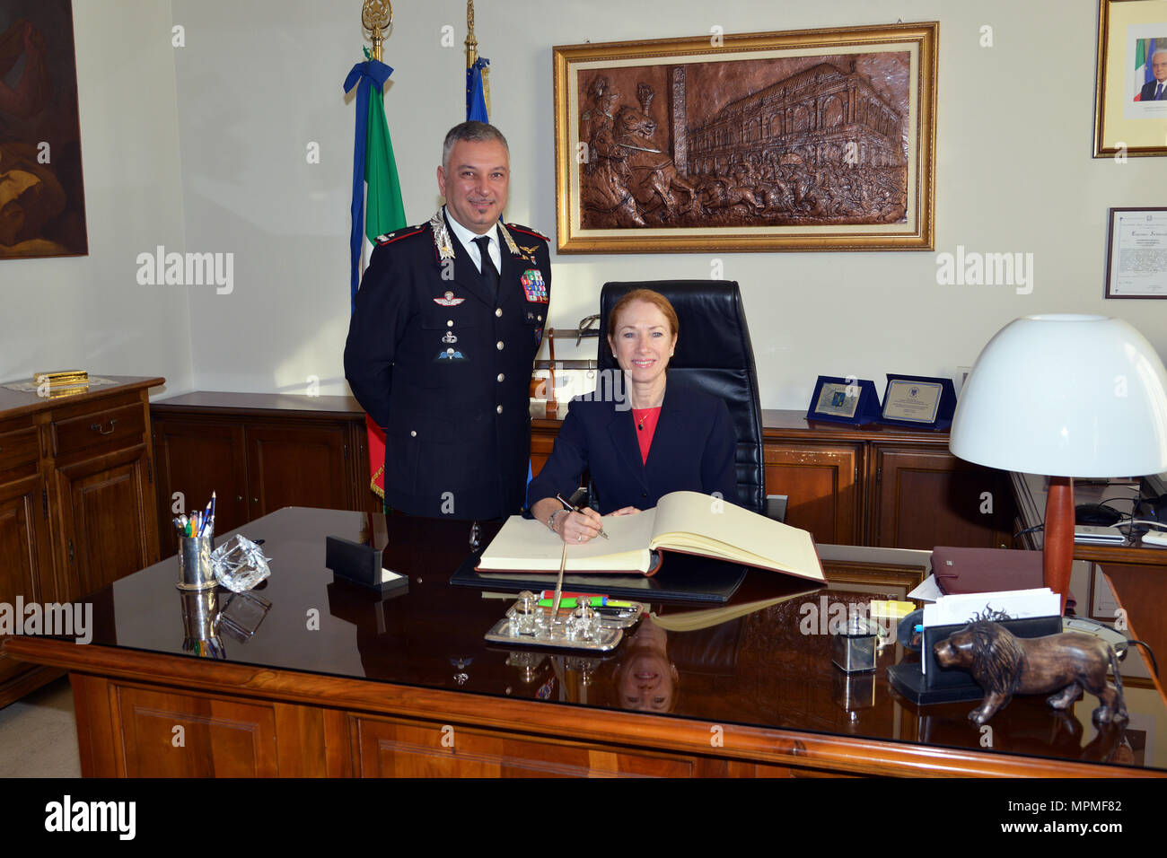 Brig. Gen. Giovanni Pietro Barbano, Center of Excellence for Stability Police Units (CoESPU) director (left), and Ms. Kelly Degnan, Charge’ d’Affaires ad interim U.S. Embassy & Consulates Italy (right), pose for photo during visit at Center of Excellence for Stability Police Units (CoESPU) Vicenza, Italy, Mar. 30, 2017.(U.S. Army Photo by Visual Information Specialist Antonio Bedin/released) Stock Photo