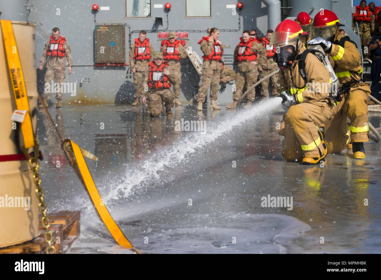 Soldiers with the 481st Transportation Detachment react to a fire drill