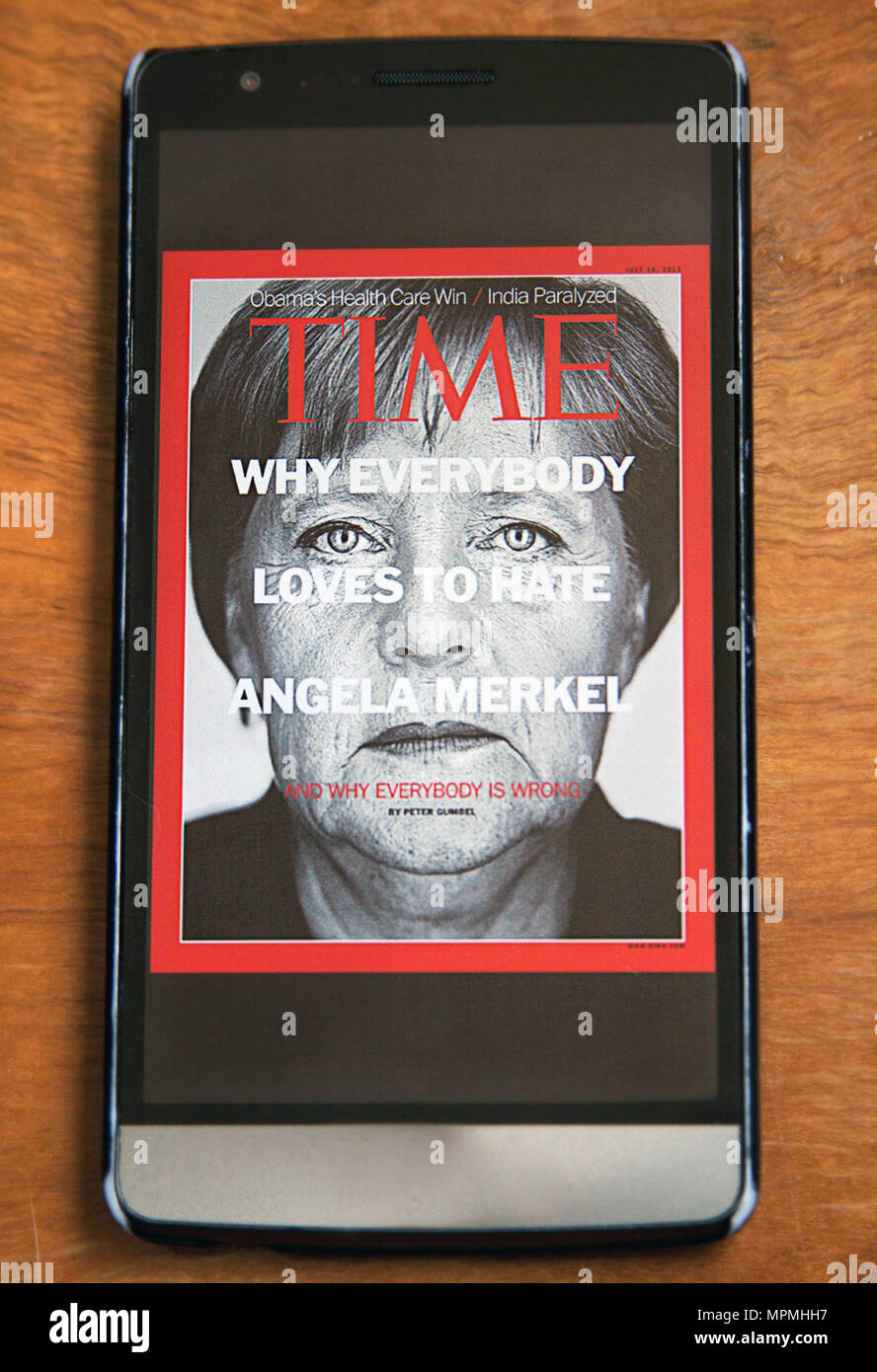 Angela Merkel on the Cover of Time magazine on a Smartphone Stock Photo