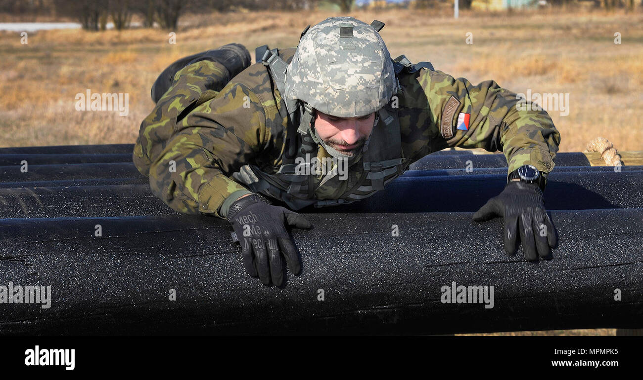 Senior Master Sgt. Karel Dostalek, an Airman in the Czech Republic Armed Forces, maneuvers over an obstacle during the Best Warrior competition, March 3. Dostalek was one of three Czech service members who visited Nebraska to observe and participate in the Nebraska Army National Guard’s Best Warrior competition through the State Partnership Program. Stock Photo