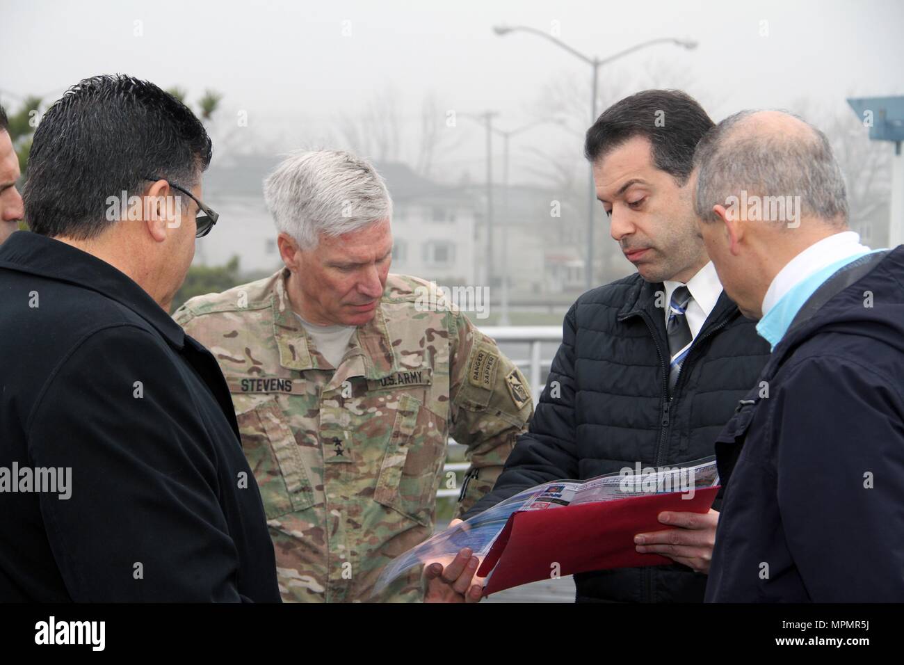 Frank Verga, New York District, U.S. Army Corps of Engineers (second from right), briefs U.S. Army Corps of Engineers Deputy Commanding General Maj. Gen. Rick Stevens (second from left) on April 4, 2017, describing details about Hurricane Sandy coastal storm risk management work planned for south Staten Island. Staten Island, a borough of New York City, suffered significant loss of life and property damage due to Hurricane Sandy's storm surge. Joe Vietri (left), North Atlantic Division's (NAD's) Chief of Planning, and Joe Forcina (right), NAD Sandy Coastal Management Division, provide regional Stock Photo