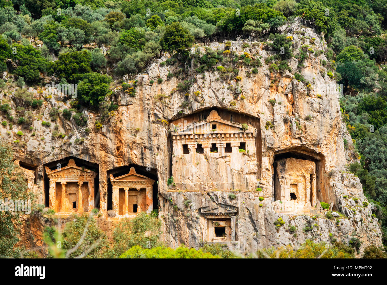 Close-up of ancient tombs on the Dalyan river in Turkey, including the largest unfinished tomb. Stock Photo