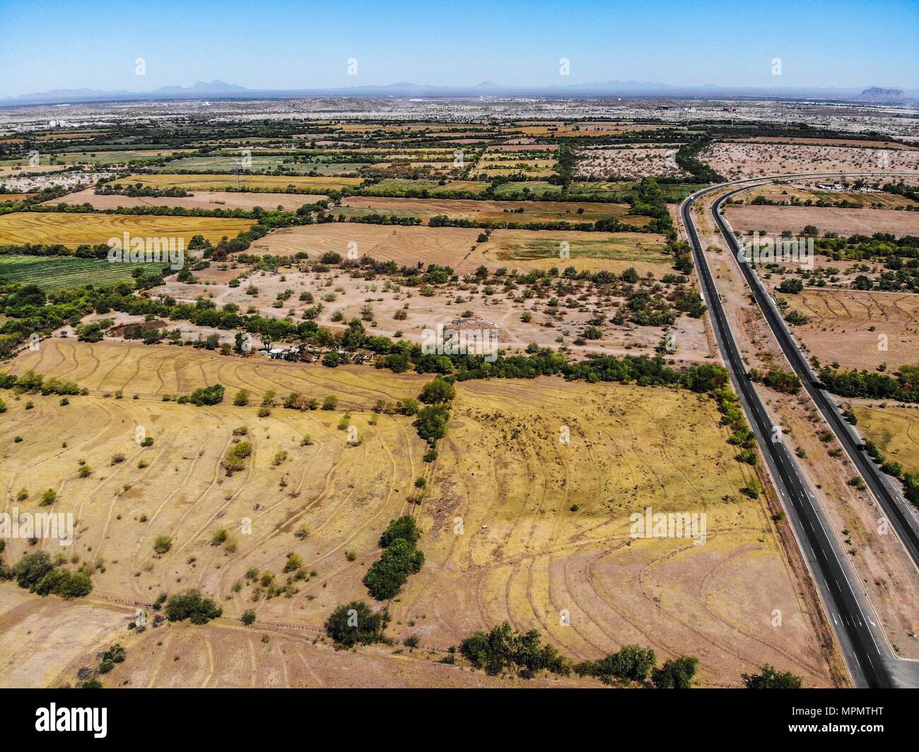 Aerial view, aerial photograph of the paved lanes of Quiroga Boulevard to  the west of the city of Hermosillo. cultivation and field ejido la Yesca  Stock Photo - Alamy