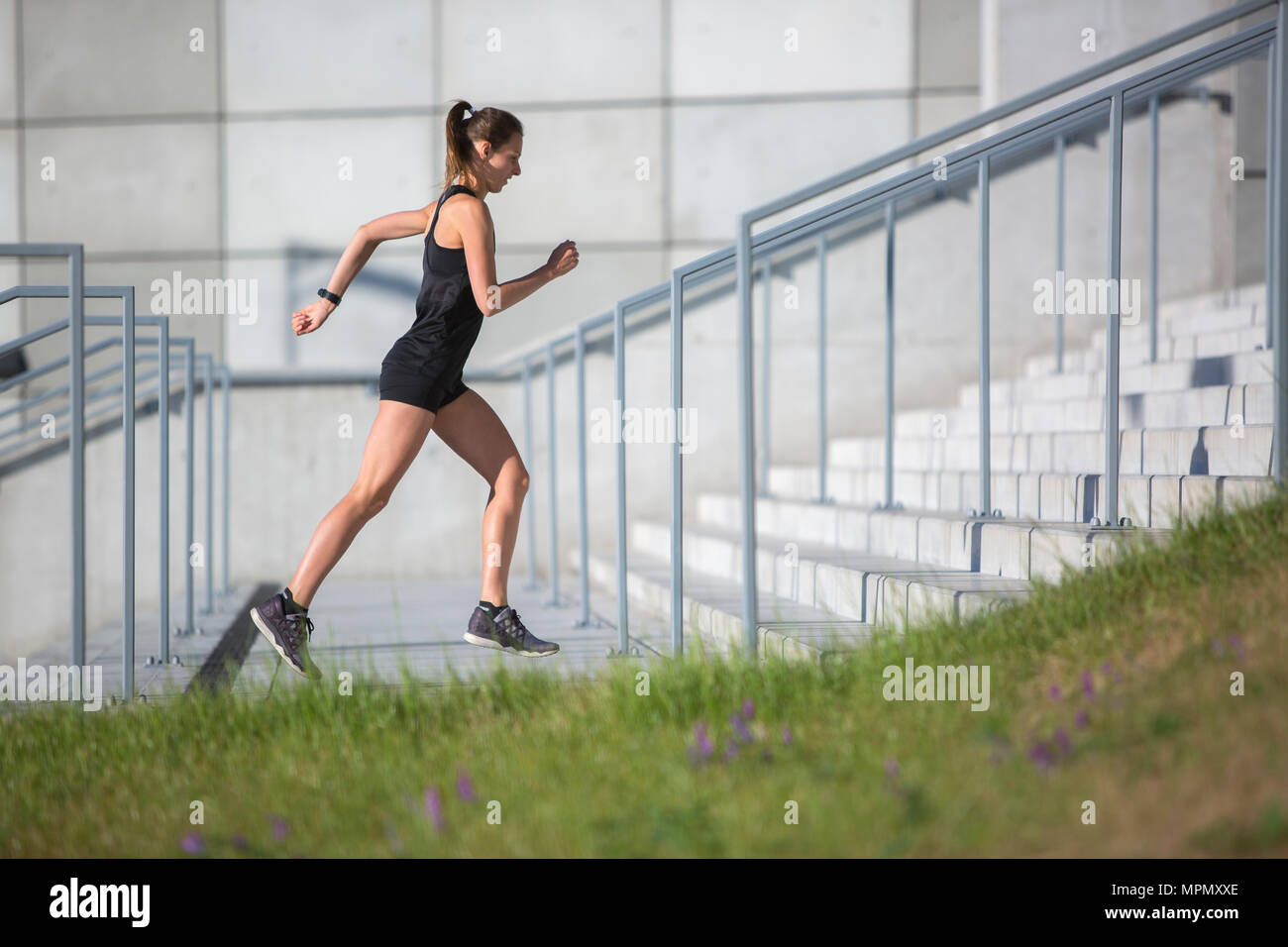 Female Urban Runner training on Concrete stairs Stock Photo Alamy