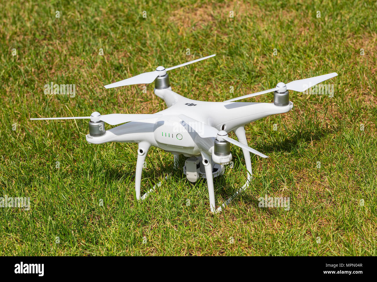A DJI Phantom 4 Pro drone standing on green grass, rear view, focus on the  drone Stock Photo - Alamy
