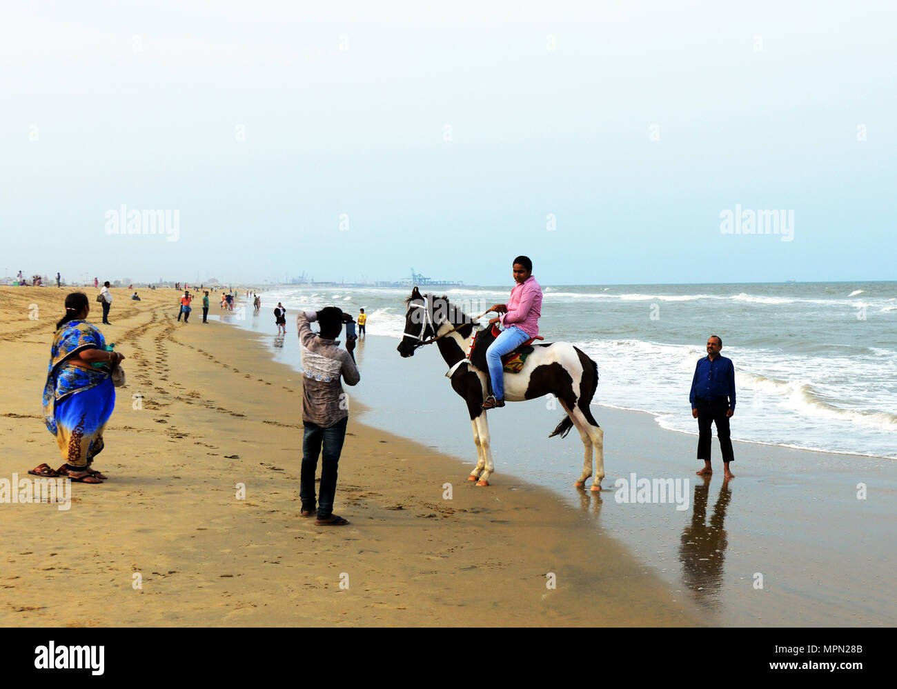 Horse riding on Marina beach in Chennai, India. Stock Photo