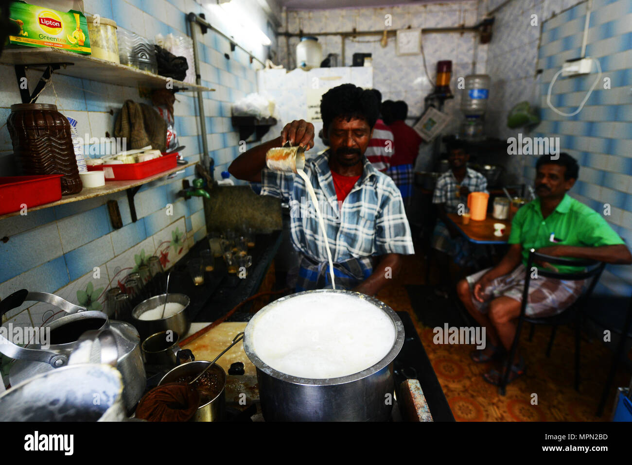 Chai ( Indian milk tea ) preparation in Chennai, India. Stock Photo