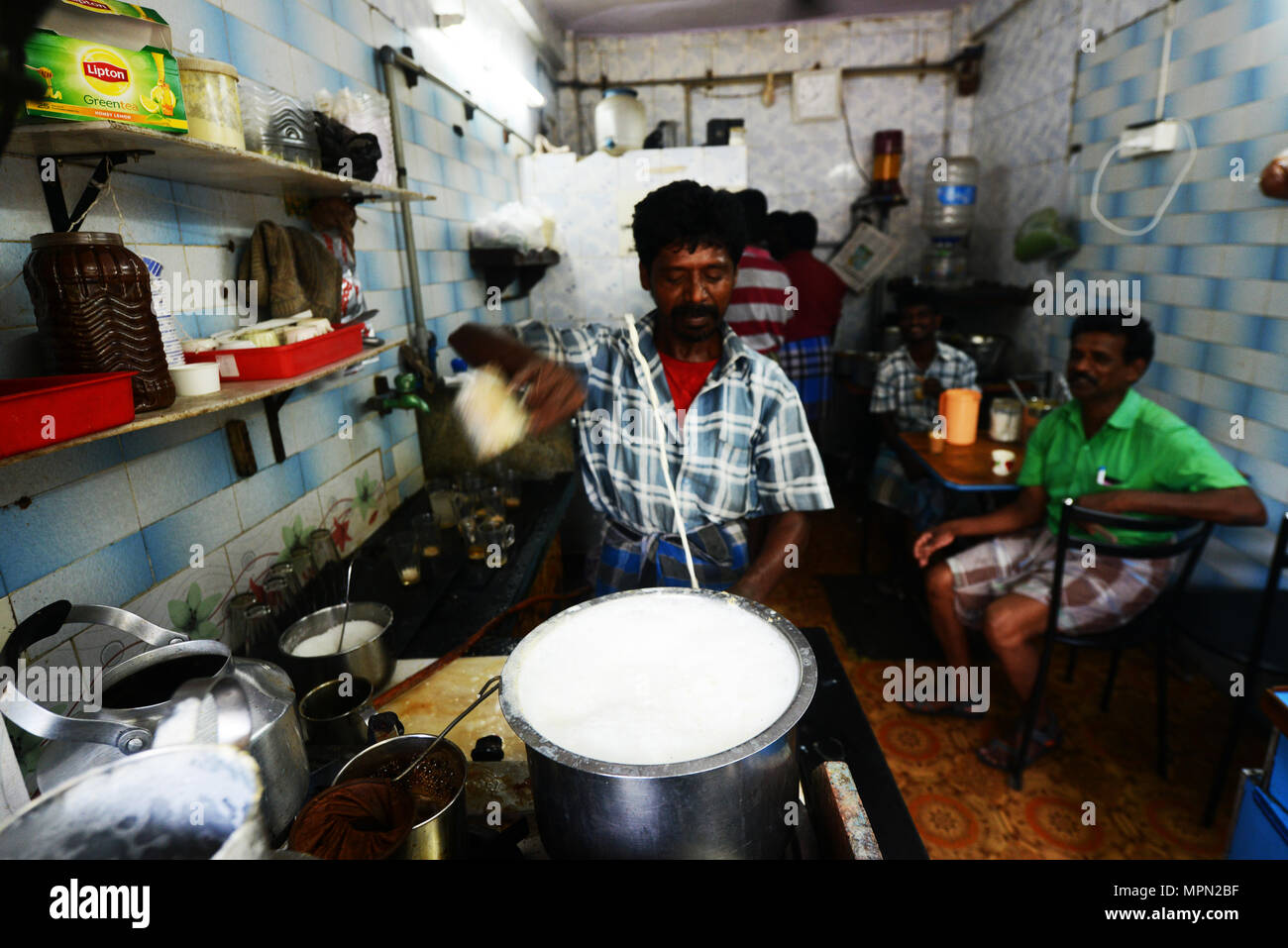 Chai ( Indian milk tea ) preparation in Chennai, India. Stock Photo