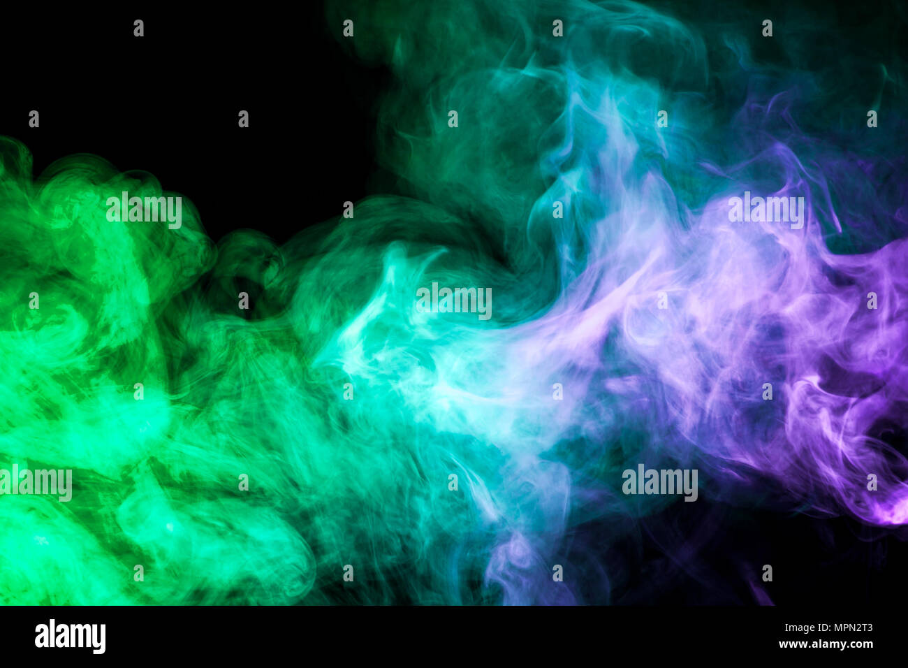 Blue and green smoke on black background Stock Photo - Alamy
