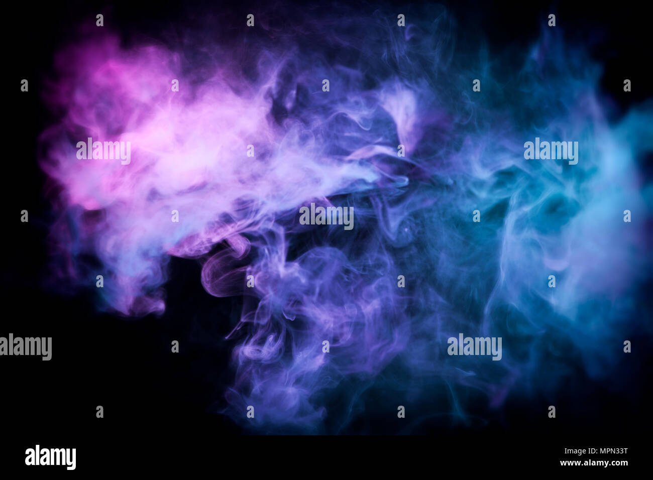 Cloud of blue and pink smoke on a black isolated background. Background ...