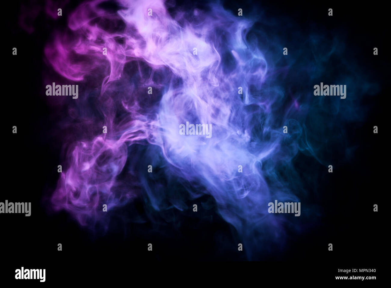 Cloud of blue and pink smoke on a black isolated background. Background ...