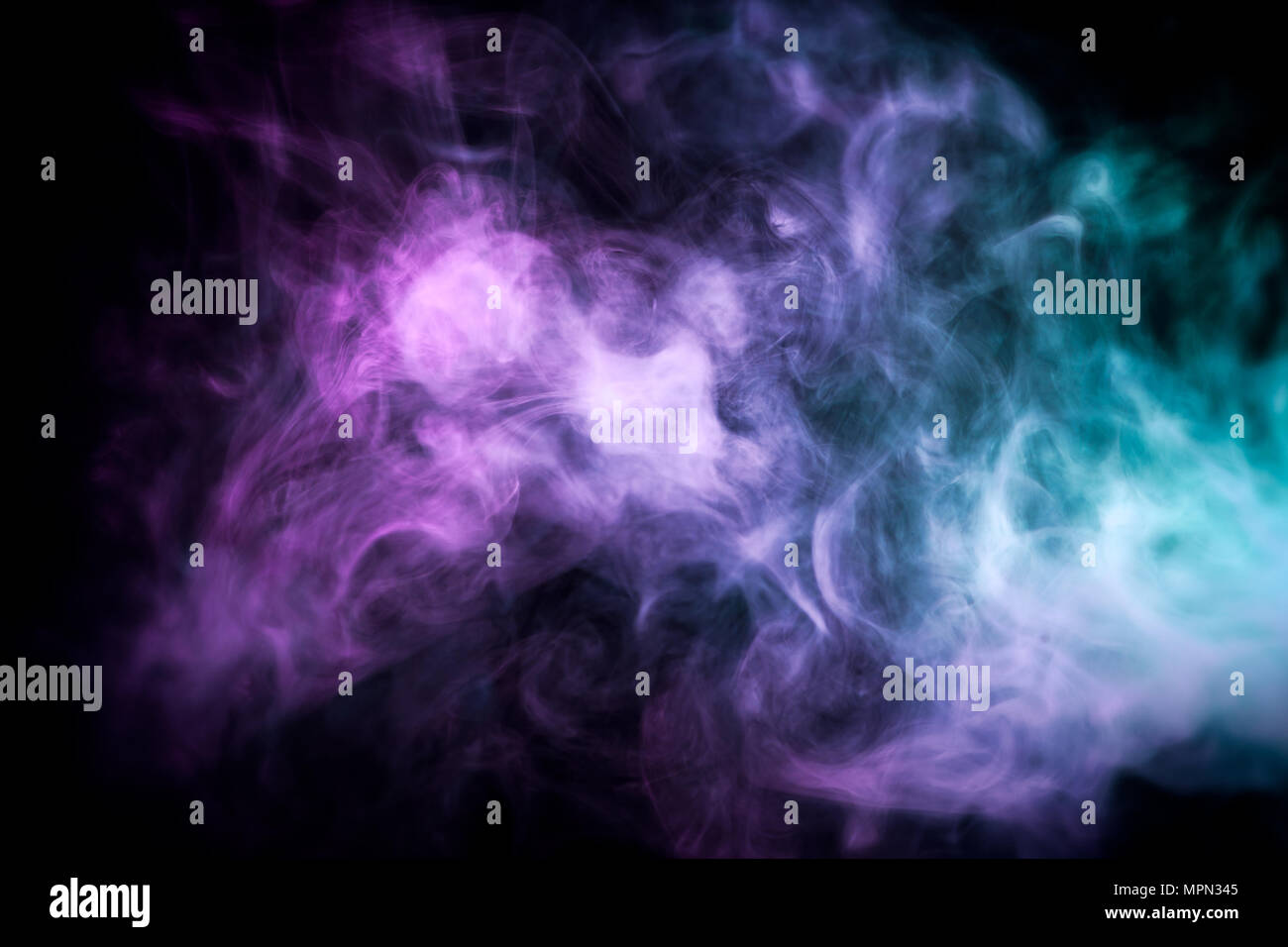 Cloud of blue and pink smoke on a black isolated background. Background ...