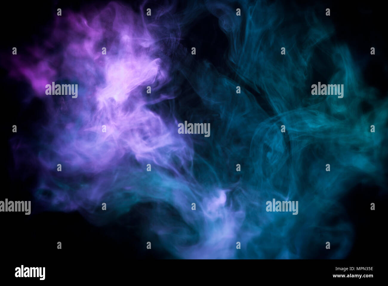 Cloud of blue and pink smoke on a black isolated background. Background ...