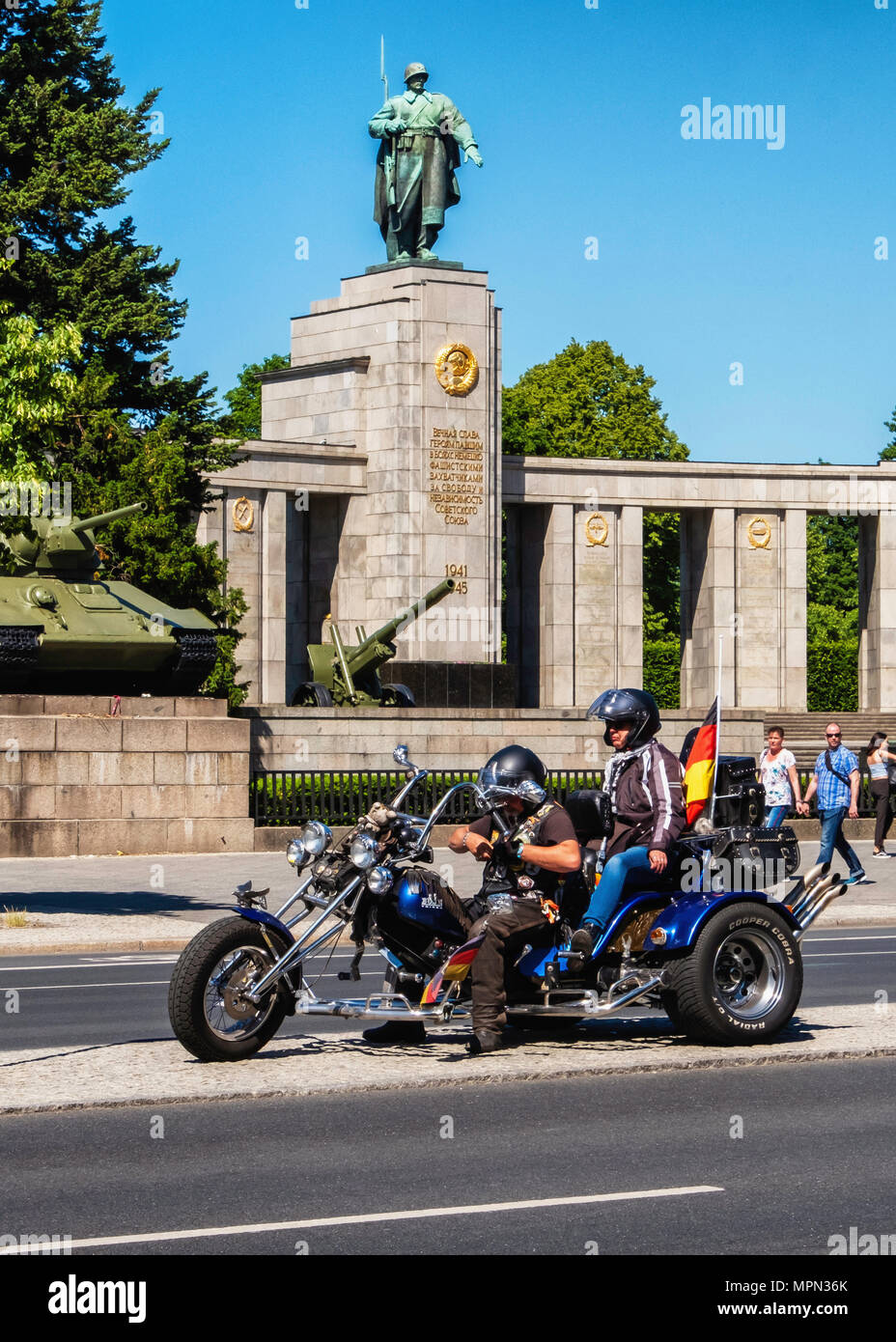 Berlin Mitte, Motor biker and passenger on three wheeler in front of Soviet War memorial. Hundreds of Bikers protest at the Brandenburg Gate for prote Stock Photo