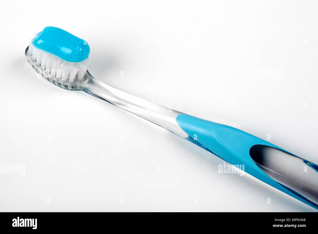 a toothbrush and a toothpaste on white background Stock Photo - Alamy
