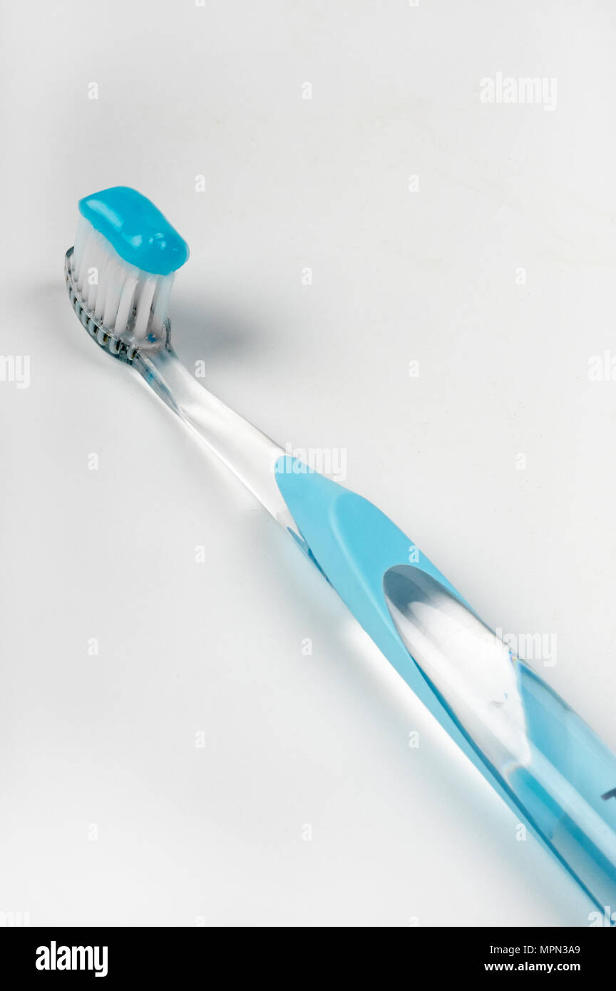 a toothbrush and a toothpaste on white background Stock Photo - Alamy