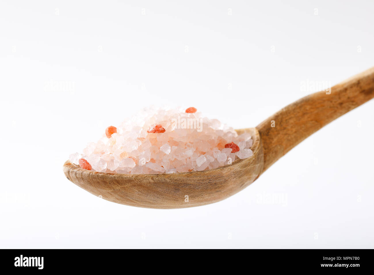 spoon of coarse grained salt on white background Stock Photo