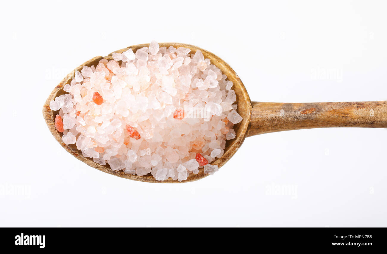 Sharp Salt Stuff spoon of coarse grained salt on white background Stock Photo - Alamy
