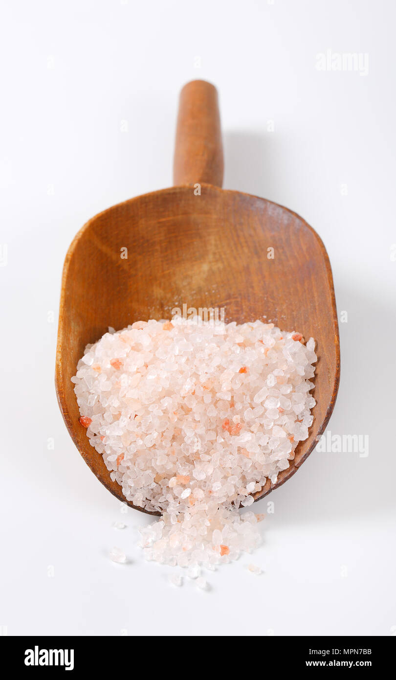 scoop of coarse grained salt on white background Stock Photo